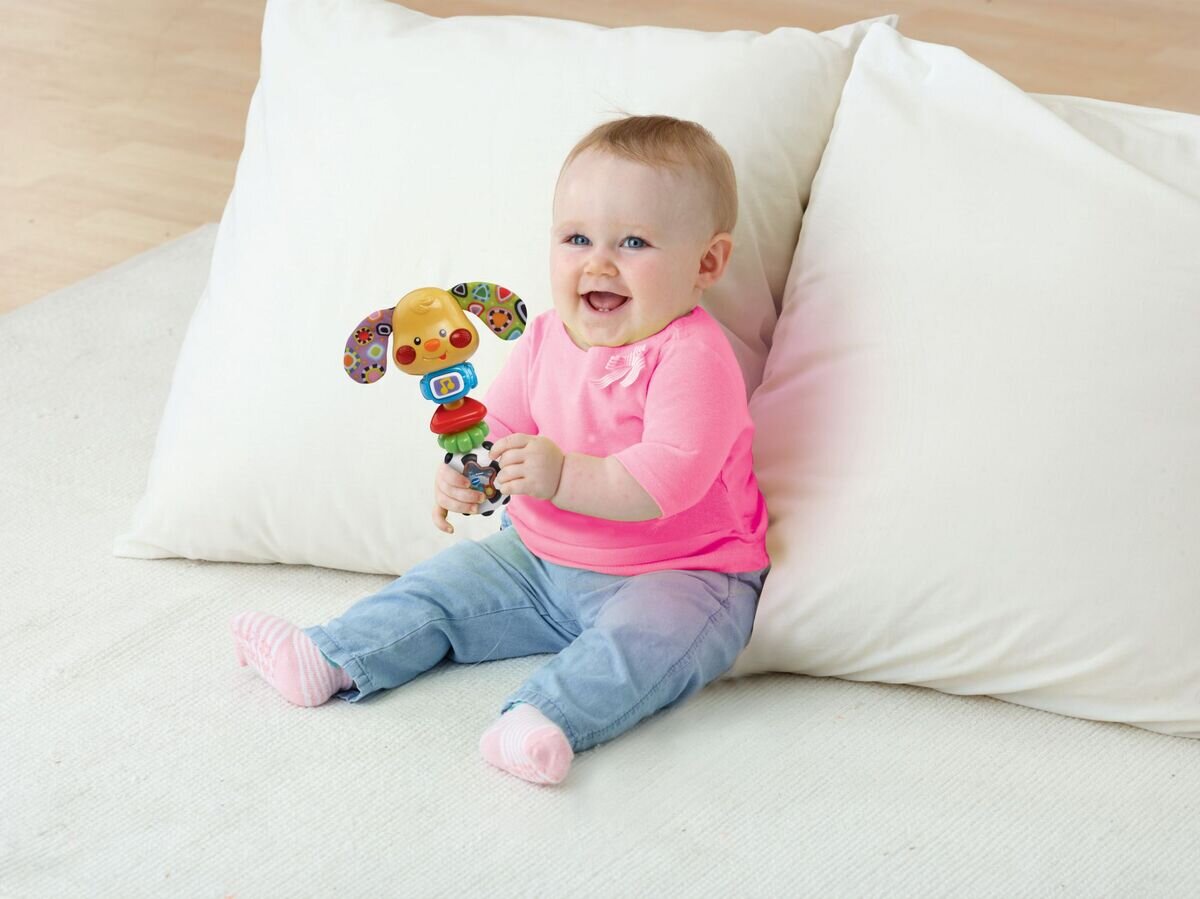 VTech Wauwau-Rassel interaktive Rassel-Hündchen mit Musik & Lichtern, ab 3 Monaten VTech Wauwau-Rassel mit Musik-Taste, blinkenden Backen, Bewegungssensor, 3 gesungenen Liedern, 10 Melodien, kindersicheres Batteriefach, ab 3 Monaten,